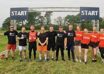 Firefighters brave Dorset Mud Run for charity