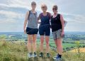 Local trio complete hilly half marathon for young people’s charity