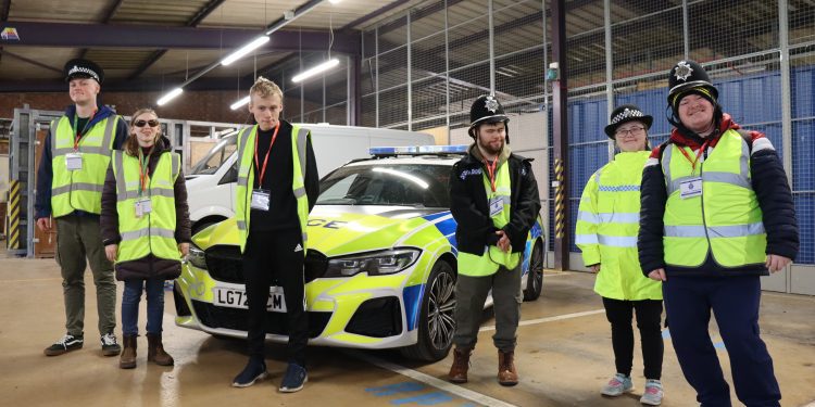 Young people visit police headquarters for behind-the-scenes tour