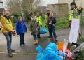 Volunteers clean up local village