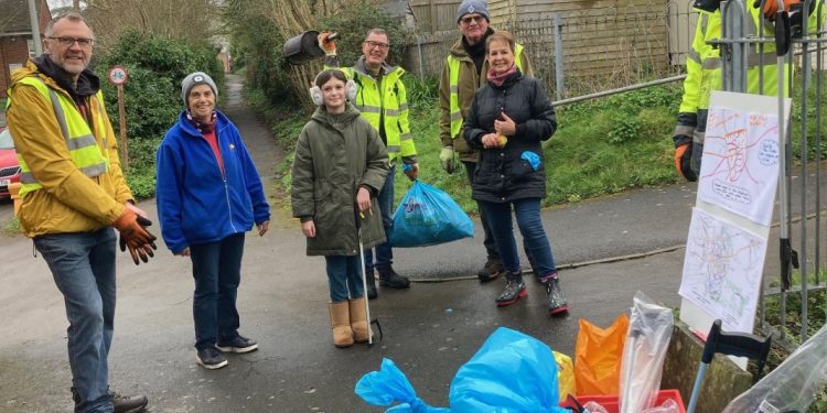 Volunteers clean up local village