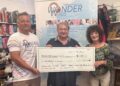 Second-hand shop supports charity with £1,000 donation
